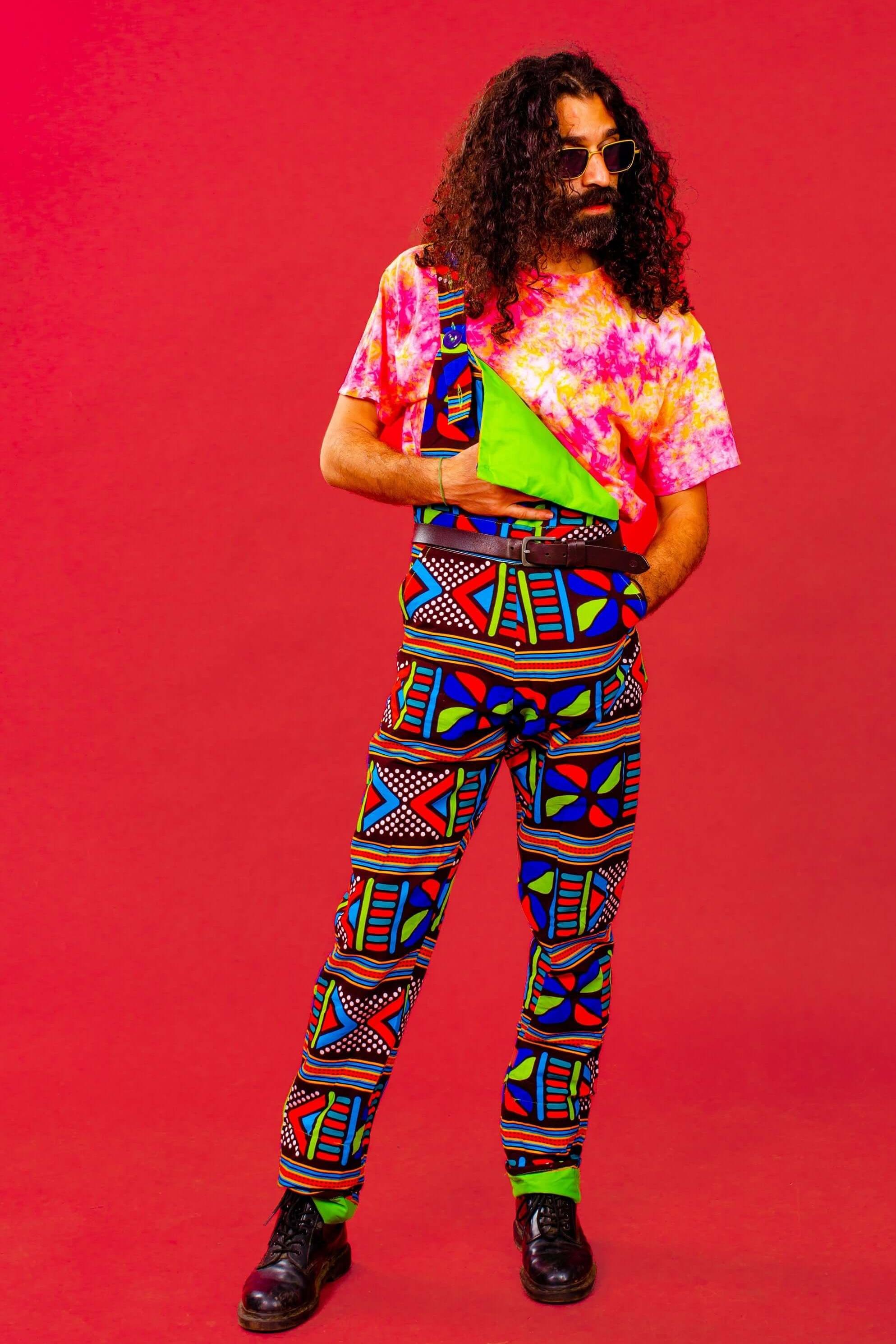 Man wearing African print unisex dungarees