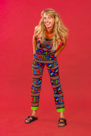Woman wearing African print unisex dungarees