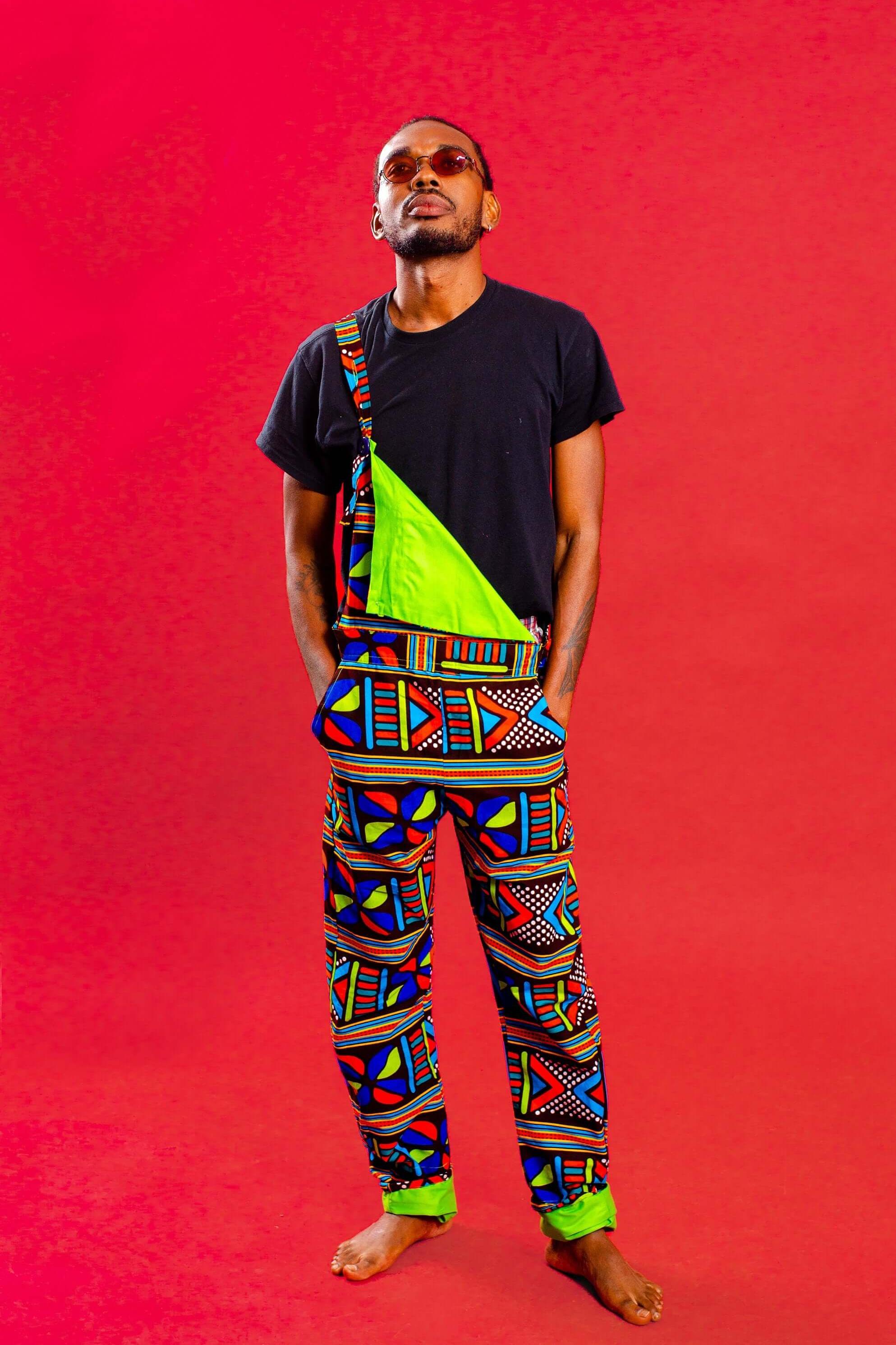 Man wearing African print unisex dungarees