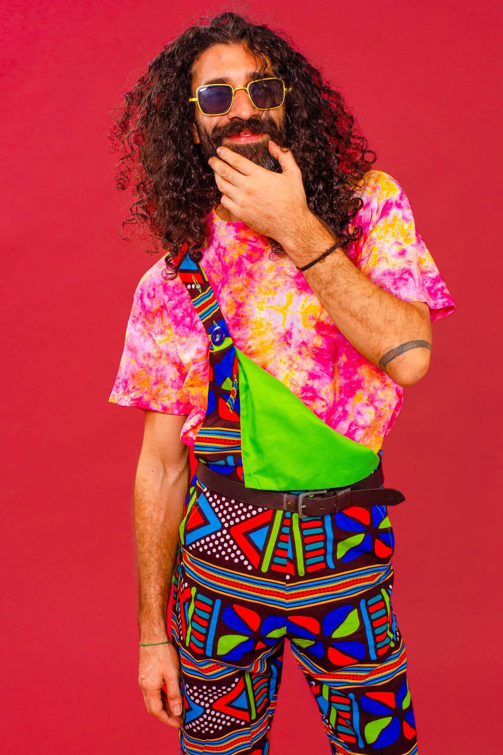 Man wearing African print unisex dungarees