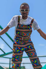 Man wearing African print unisex dungarees