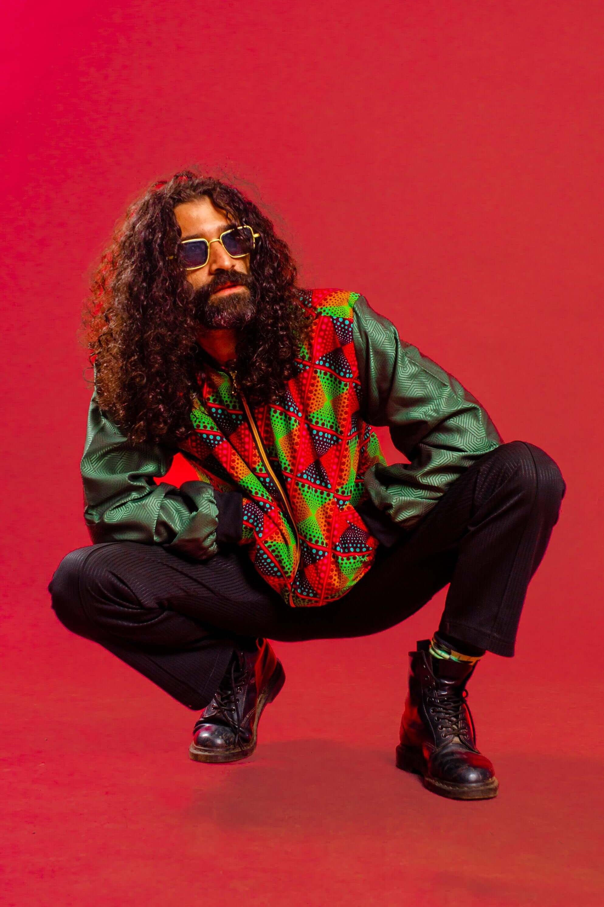 Man in trippy festival bomber jacket