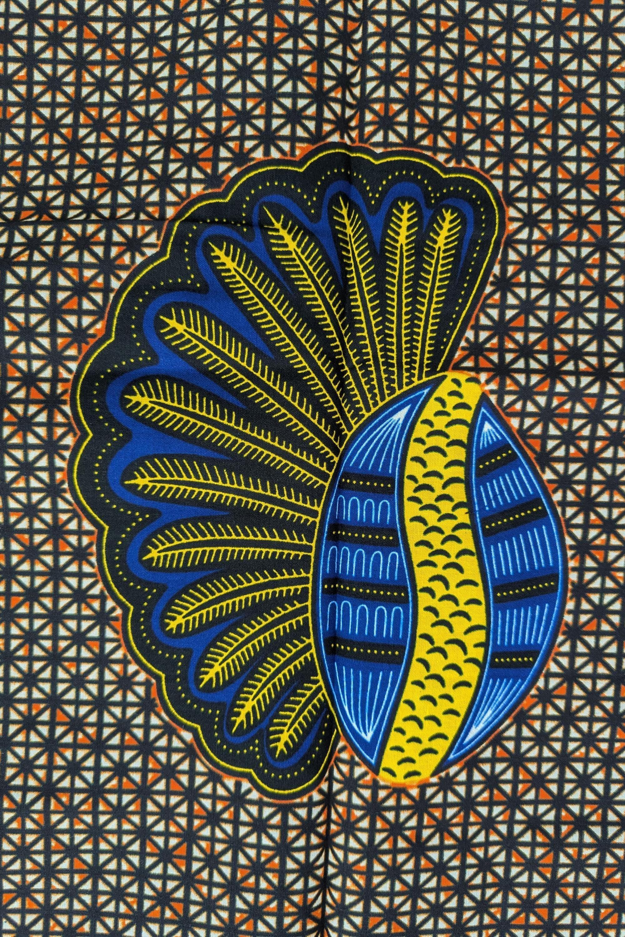 African wax print fabric featuring a repeating pattern of bold banana seed motifs in blue, yellow, and black. Each seed design has a fan-like shape on one side and a curved oval on the other, set against a detailed geometric background of small cream and brown triangles. The vibrant colours and symmetrical layout make this fabric ideal for striking garments or accessories.