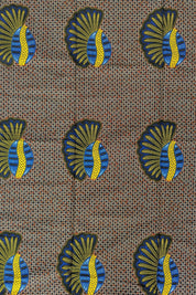 African wax print fabric featuring a repeating pattern of bold banana seed motifs in blue, yellow, and black. Each seed design has a fan-like shape on one side and a curved oval on the other, set against a detailed geometric background of small cream and brown triangles. The vibrant colours and symmetrical layout make this fabric ideal for striking garments or accessories.