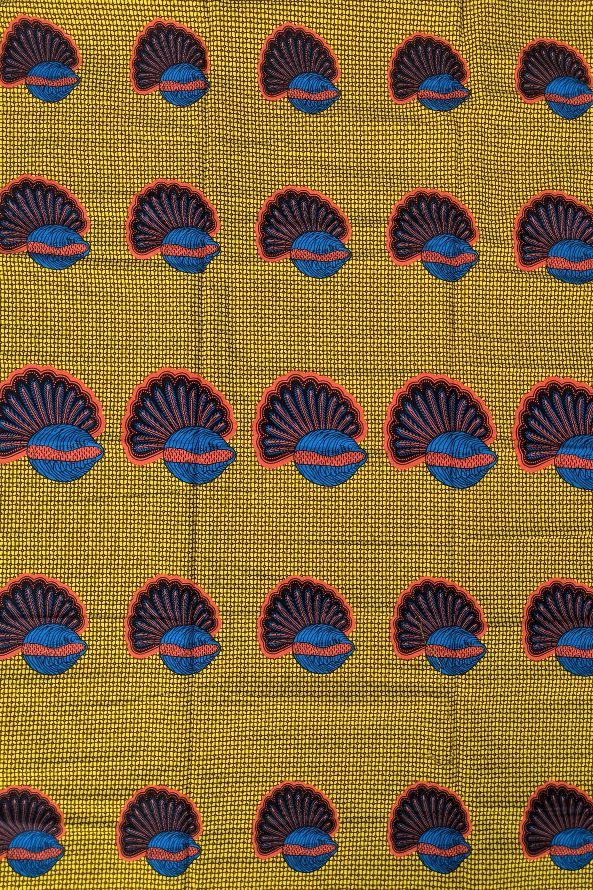 African wax print fabric featuring a repeating pattern of abstract banana seed motifs in deep blue and brown with red accents, set against a vibrant yellow background with a fine grid-like texture. The rounded, fan-like shapes are evenly spaced, creating a bold and structured design ideal for statement fashion, accessories, or decor.