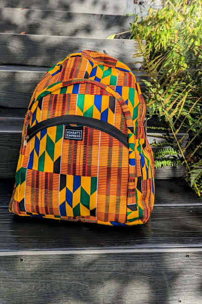 https://ashantiempress.com/cdn/shop/files/Kente-African-Print-Backpack-2_grande.jpg?v=1703084150