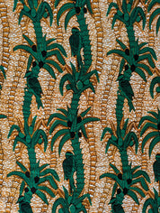 Tropical-themed African wax print fabric featuring green palm trees with coconuts and perched birds, set against a warm background of textured golden-brown lines. The repeating pattern creates a lush, jungle-like feel, perfect for vibrant fashion, home decor, or craft projects.