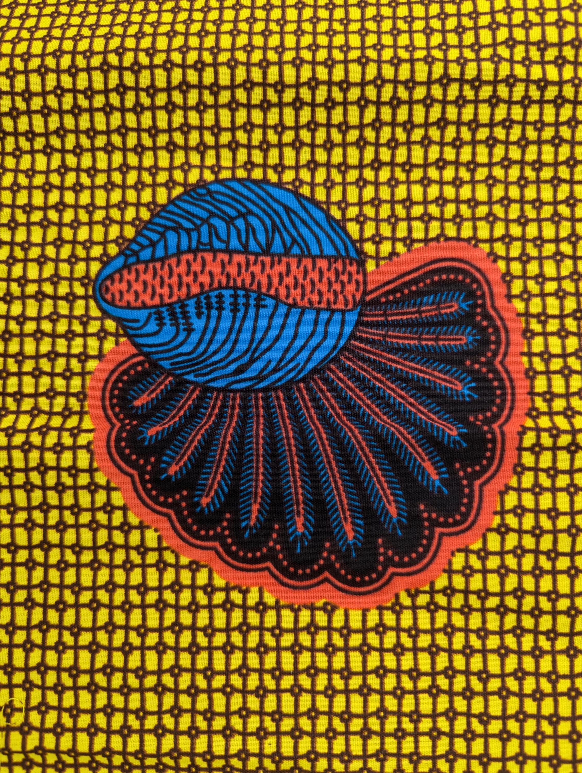 African wax print fabric featuring a repeating pattern of abstract banana seed motifs in deep blue and brown with red accents, set against a vibrant yellow background with a fine grid-like texture. The rounded, fan-like shapes are evenly spaced, creating a bold and structured design ideal for statement fashion, accessories, or decor.