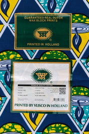 Bold African wax print VLISCO fabric featuring a repeating pattern of green and yellow candle bowls with blue flames, set inside alternating teal and yellow triangles on a dark blue background.