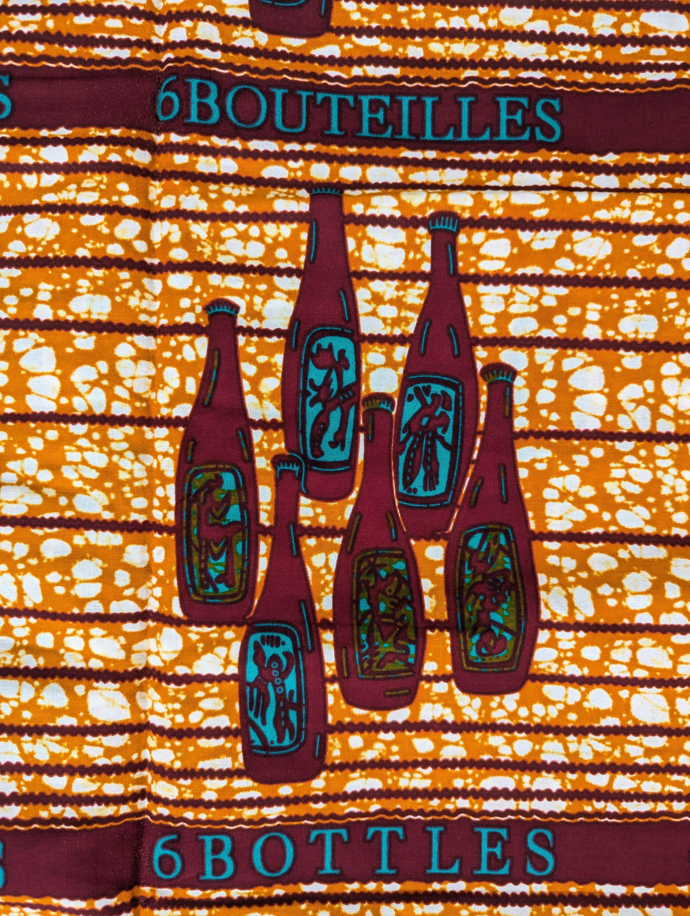 African wax print fabric with a repeating motif of six brown bottles in each cluster, arranged in neat rows across a textured orange and white background. The design includes the words &quot;6 BOTTLES&quot; and &quot;6 BOUTEILLES&quot; in teal lettering, alternating in English and French. A quirky and bold print, perfect for playful fashion or unique home decor.